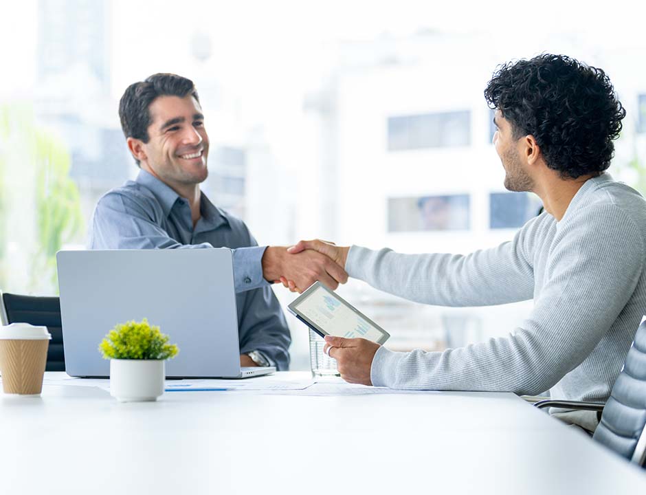 Two people shaking hands.